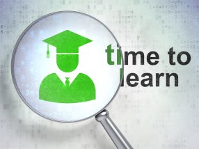 Education concept: Student and Time to Learn with optical glass